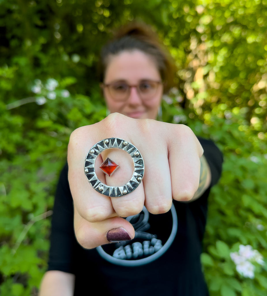 Pyramid Power Sun Ring with a red garnet