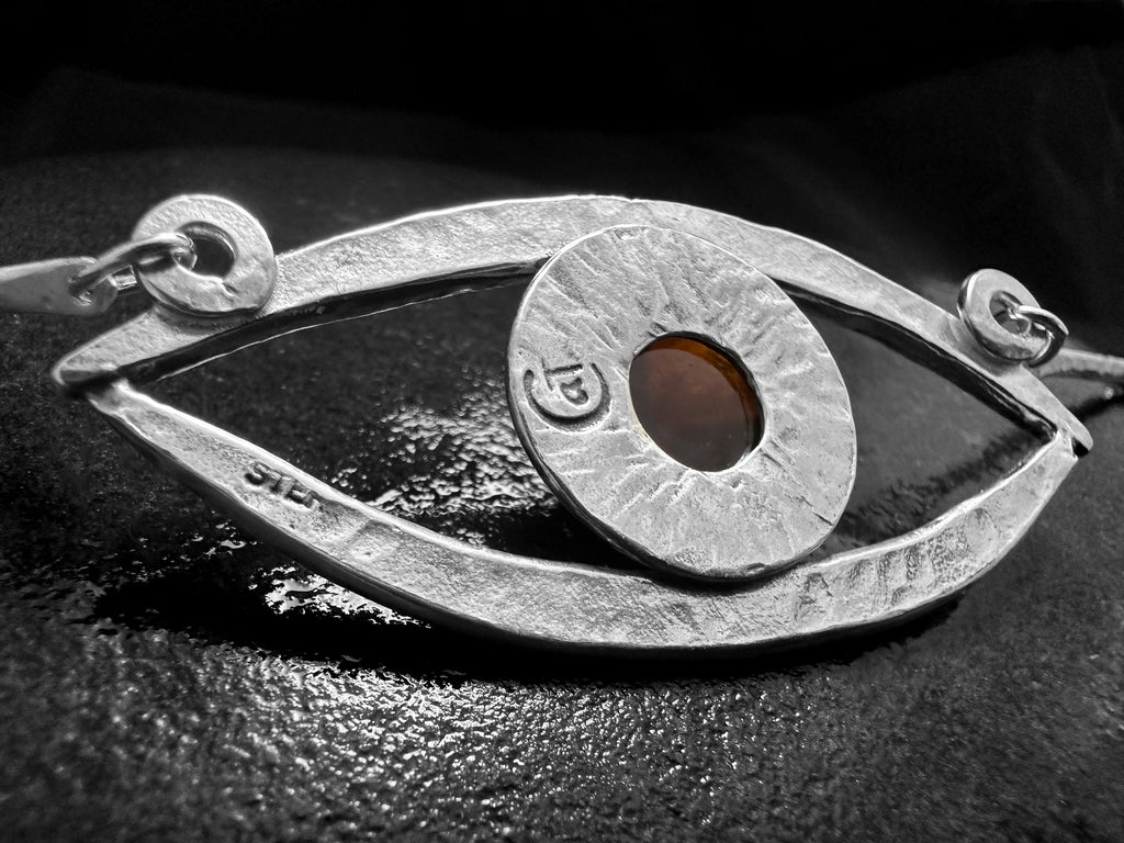 Divining Eye handcrafted silver pendant with red garnet